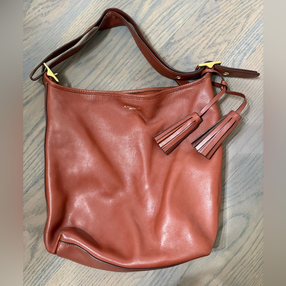 Brown (camel) leather Coach purse.